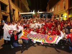 After leaving the podium area, the team joins Mr. Ichikawa and local guests of Hino Motors for a group photo.