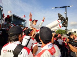 Teruhito Sugawara is thrown in the air in celebration.