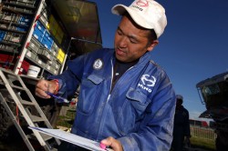 Mechanic sub-leader Takeshi Suenaga goes over the work checklist. 