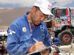 Mechanic sub-leader Takeshi Suenaga goes over the servicing checklist. 