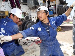 Mechanics Takashi Masuda and Shunsuke Sugawara seen here working together. 
