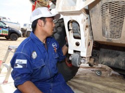 Mechanic Hironaga Hayashi inspects the front suspension. 