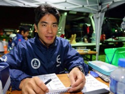 Hiroyuki Sugiura studies his road book in preparation for the race on January 13.