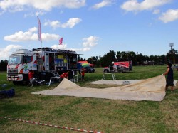 The Hino team prepares for their servicing work at the bivouac set up in a horse racing track. 