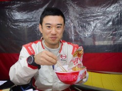 Mitsugu Takahashi enjoys a bowl of ramen in the team's tent. 
