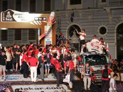 Mr. Ichikawa showers Car 1 with champagne at the podium. 