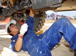 Mechanic Takashi Masuda inspects the drive train for loose components. 
