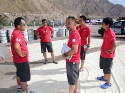 Team members discuss how to repair the problem.